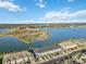 Aerial view of townhouses near a lake at 6404 Silverstar Dr, Sarasota, FL 34240