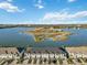 Aerial view of townhouses and lake at 6404 Silverstar Dr, Sarasota, FL 34240