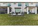 Private backyard with patio and grassy area at 6404 Silverstar Dr, Sarasota, FL 34240