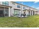 Private backyard with patio, fire pit, and grassy area at 6404 Silverstar Dr, Sarasota, FL 34240
