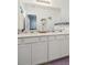 Clean bathroom featuring double vanities and a shower/tub combo at 6404 Silverstar Dr, Sarasota, FL 34240