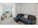 Bright bonus room with comfy sectional sofa and view at 6404 Silverstar Dr, Sarasota, FL 34240