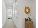 Bright hallway with view into bedroom and closets at 6404 Silverstar Dr, Sarasota, FL 34240