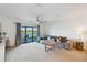 Spacious living room with access to a patio and lake views at 6404 Silverstar Dr, Sarasota, FL 34240