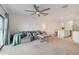 Open living room with gray sectional sofa and kitchen view at 6404 Silverstar Dr, Sarasota, FL 34240