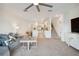 Open living area showcasing a stylish sectional sofa and modern kitchen at 6404 Silverstar Dr, Sarasota, FL 34240