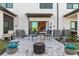 Private patio with seating, fire pit, and landscaping at 6404 Silverstar Dr, Sarasota, FL 34240
