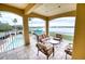 Spacious balcony overlooking pool and waterfront; includes patio furniture at 6450 Watercrest Way # 303, Lakewood Ranch, FL 34202