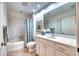 Clean bathroom with a tub shower combo and white vanity at 6450 Watercrest Way # 303, Lakewood Ranch, FL 34202