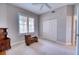 Well-lit bedroom with double door closet and window shutters at 6450 Watercrest Way # 303, Lakewood Ranch, FL 34202