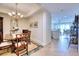 Elegant dining room with classic table and chairs, open to kitchen at 6450 Watercrest Way # 303, Lakewood Ranch, FL 34202