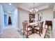 Elegant dining room with a classic wooden table and chairs at 6450 Watercrest Way # 303, Lakewood Ranch, FL 34202