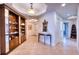 Spacious foyer with tile floors and built-in shelves at 6450 Watercrest Way # 303, Lakewood Ranch, FL 34202
