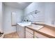 Convenient laundry room with washer, dryer, and utility sink at 6450 Watercrest Way # 303, Lakewood Ranch, FL 34202