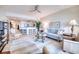 Bright living room with ample seating and kitchen access at 6450 Watercrest Way # 303, Lakewood Ranch, FL 34202