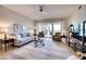 Spacious living room with comfy seating and water views at 6450 Watercrest Way # 303, Lakewood Ranch, FL 34202