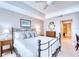 Spacious main bedroom with iron bed frame and water views at 6450 Watercrest Way # 303, Lakewood Ranch, FL 34202