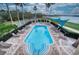 Community pool and deck area with lounge chairs at 6450 Watercrest Way # 303, Lakewood Ranch, FL 34202