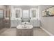 Spa-like bathroom with a large soaking tub and double vanity at 7014 Whittlebury Trl, Lakewood Ranch, FL 34202