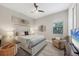 Spacious bedroom with large bed, sitting chair, and TV at 7014 Whittlebury Trl, Lakewood Ranch, FL 34202