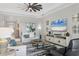 Open living space with a large TV, comfortable seating, and lots of natural light at 7014 Whittlebury Trl, Lakewood Ranch, FL 34202