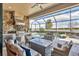 Outdoor kitchen and seating area with lake view at 7014 Whittlebury Trl, Lakewood Ranch, FL 34202