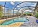 Relaxing screened pool and spa with lake view at 7014 Whittlebury Trl, Lakewood Ranch, FL 34202