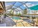 Screened pool and spa with outdoor seating at 7014 Whittlebury Trl, Lakewood Ranch, FL 34202