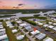 Aerial view showing home's waterfront location in a community at 716 Blackburn Blvd, North Port, FL 34287