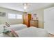 Twin bedroom with wood dresser and window at 716 Blackburn Blvd, North Port, FL 34287