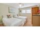 Twin bedroom with light walls and flamingo decor at 716 Blackburn Blvd, North Port, FL 34287