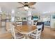 Light and airy dining area with a hexagonal table and four chairs at 716 Blackburn Blvd, North Port, FL 34287