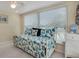 Bright guest bedroom with daybed, window blinds, and coastal decor at 716 Blackburn Blvd, North Port, FL 34287