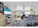 Relaxing living room featuring a gray couch and wicker coffee table at 716 Blackburn Blvd, North Port, FL 34287