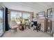 Sunroom features a workspace, rocking chair, and nautical decor at 716 Blackburn Blvd, North Port, FL 34287