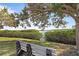 Tranquil waterfront view with a park bench at 716 Blackburn Blvd, North Port, FL 34287