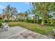 Private backyard with patio and lush landscaping at 7167 Wood Creek Dr # 3, Sarasota, FL 34231