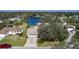 Bird's-eye view of a house near a lake in a residential area at 8006 Oak Dr, Palmetto, FL 34221