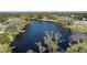 Aerial view of a waterfront property with a dock and boat at 8006 Oak Dr, Palmetto, FL 34221