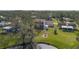 Aerial view showcasing a home's backyard, shed, and neighborhood at 8006 Oak Dr, Palmetto, FL 34221