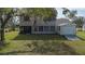 Two-story house with a screened porch and detached shed at 8006 Oak Dr, Palmetto, FL 34221