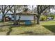 Backyard with a blue bench and a white board at 8006 Oak Dr, Palmetto, FL 34221