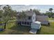 House with a large backyard, shed, and wooden ramp at 8006 Oak Dr, Palmetto, FL 34221