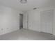 Simple bedroom with tile floor and a large closet at 8006 Oak Dr, Palmetto, FL 34221
