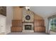 Stone fireplace with built-in wooden cabinets on either side at 8006 Oak Dr, Palmetto, FL 34221