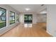 Bright Gathering room featuring hardwood floors and a view to the backyard at 8006 Oak Dr, Palmetto, FL 34221