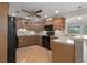 Well-equipped kitchen featuring wood cabinets and black appliances at 8006 Oak Dr, Palmetto, FL 34221