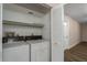 Bright laundry room with washer and dryer, and shelving for storage at 8006 Oak Dr, Palmetto, FL 34221