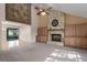 Living room features a stone fireplace, high ceilings and hardwood floors at 8006 Oak Dr, Palmetto, FL 34221