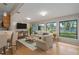 Living room with large windows, water view and hardwood floors at 8006 Oak Dr, Palmetto, FL 34221